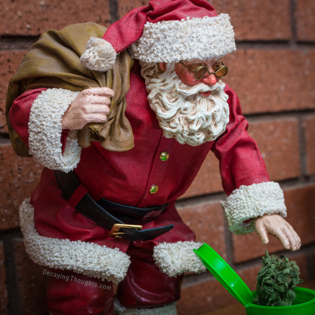 Santa reaching for a bud of Cannabis in a poptop container